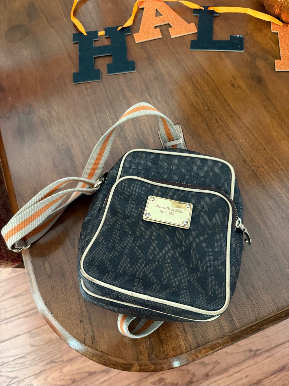 Michael Kors Black Signature Logo Crossbody Purse Orange Stripe Strap